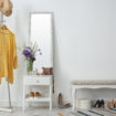 Stylish hallway interior with mirror and rack