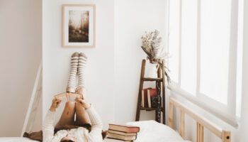 woman-enjoying-reading-stylish-room