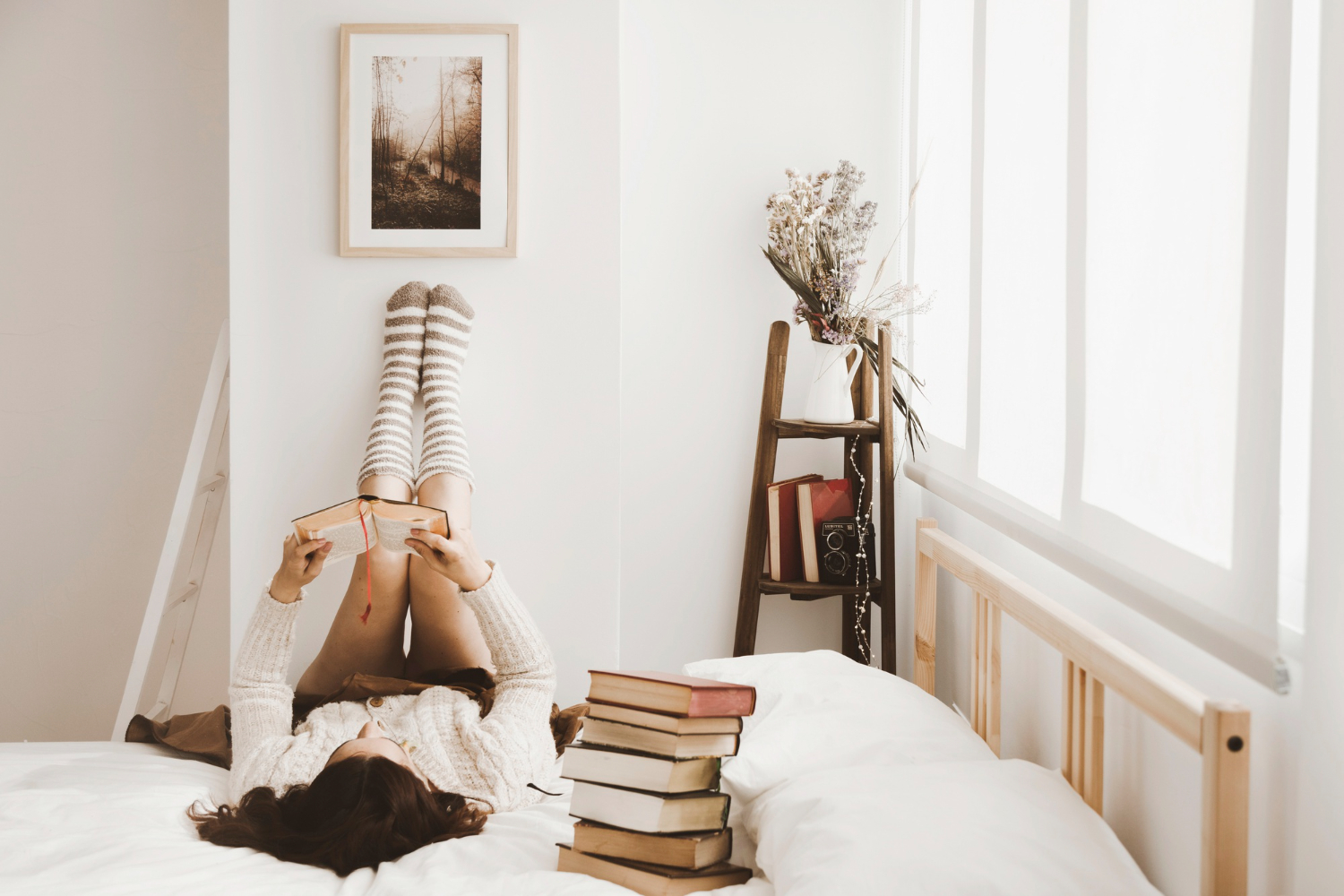 woman-enjoying-reading-stylish-room